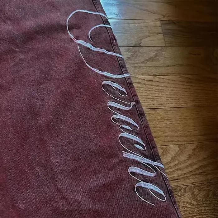 Jean Vintage délavé à rivets rouges pour femmes