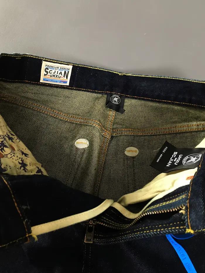 Jeans en denim bleu brut amples pour homme style rétro américain voyage printemps durable robuste