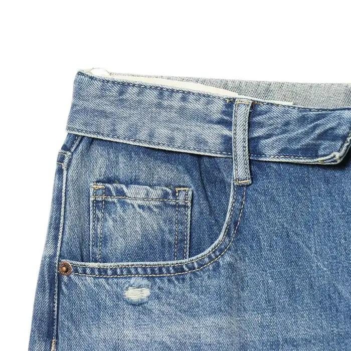 Nouvelles collections 2026 : Jean décontracté français pour femme avec détails perforés et taille mi-haute plissée