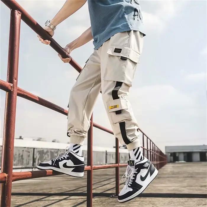 Pantalon cargo homme décontracté style hip-hop couleurs tendance plusieurs poches streetwear rubans techwear pantalon de survêtement pour garçons四季适用男式休闲裤Cargo风格