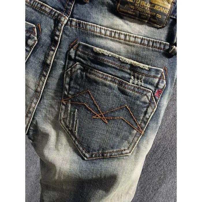 Style italien mode hommes jean rétro bleu élastique coupe ajustée déchiré