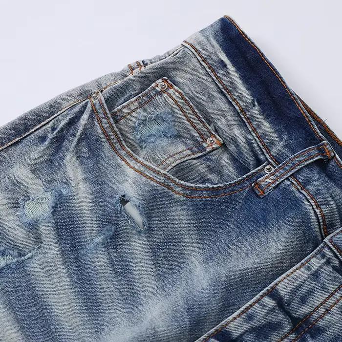 Nouveau jean Y2K bleu clair délavé avec patch en cuir noir vieilli