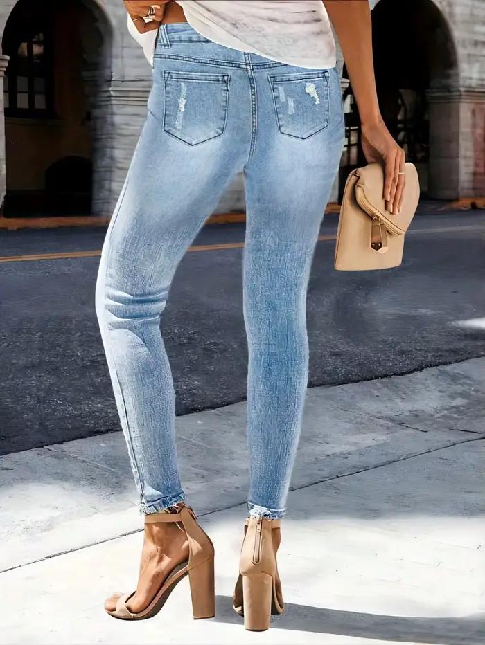 Jean slim déchiré en denim délavé à motif barbe de chat