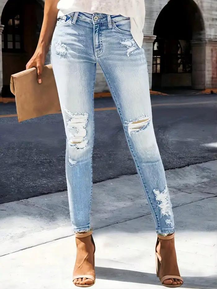 Jean slim déchiré en denim délavé à motif barbe de chat