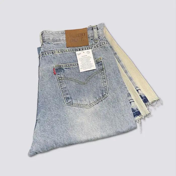 Jeans pattes d'éléphant en denim délavé et usé avec patchwork