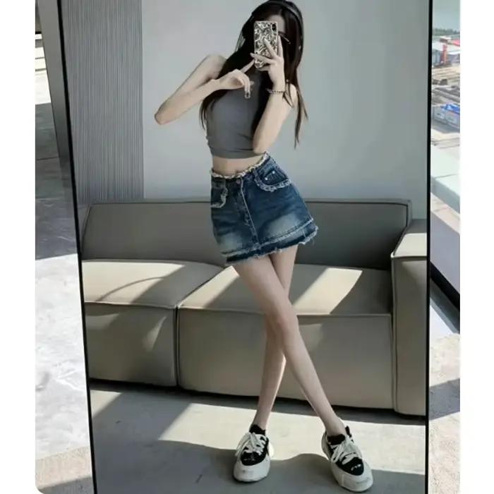 Jupe courte en jean vintage taille haute à ourlet effiloché pour femme