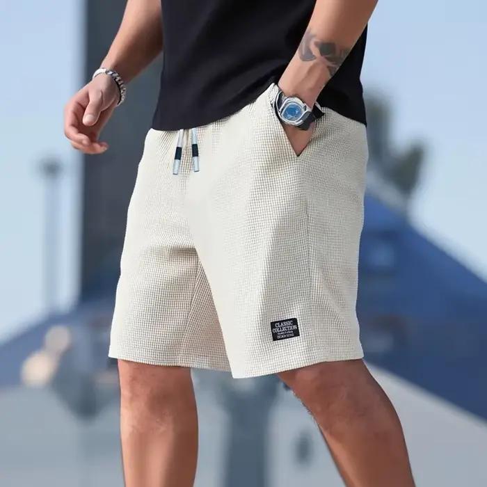 Shorts pour hommes en tissu texturé, respirants et décontractés, idéaux pour plage, sport et sorties estivales