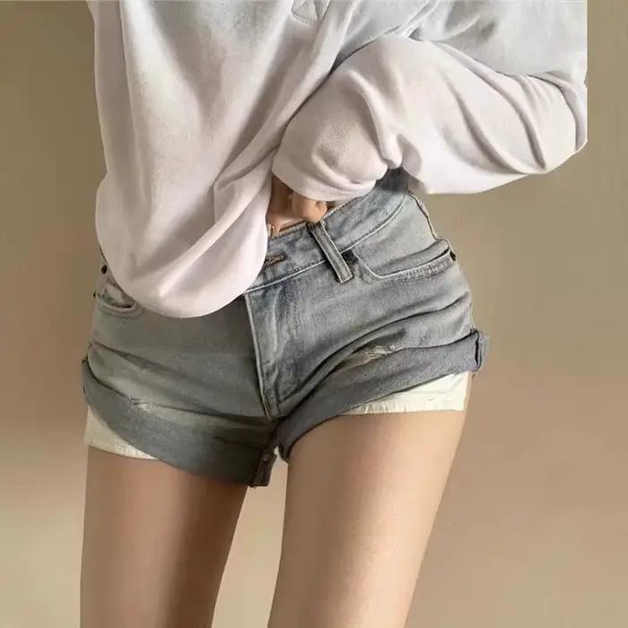 Shorts en jean déchirés rétro taille basse pour femme – Collection été 2026 – Short moulant