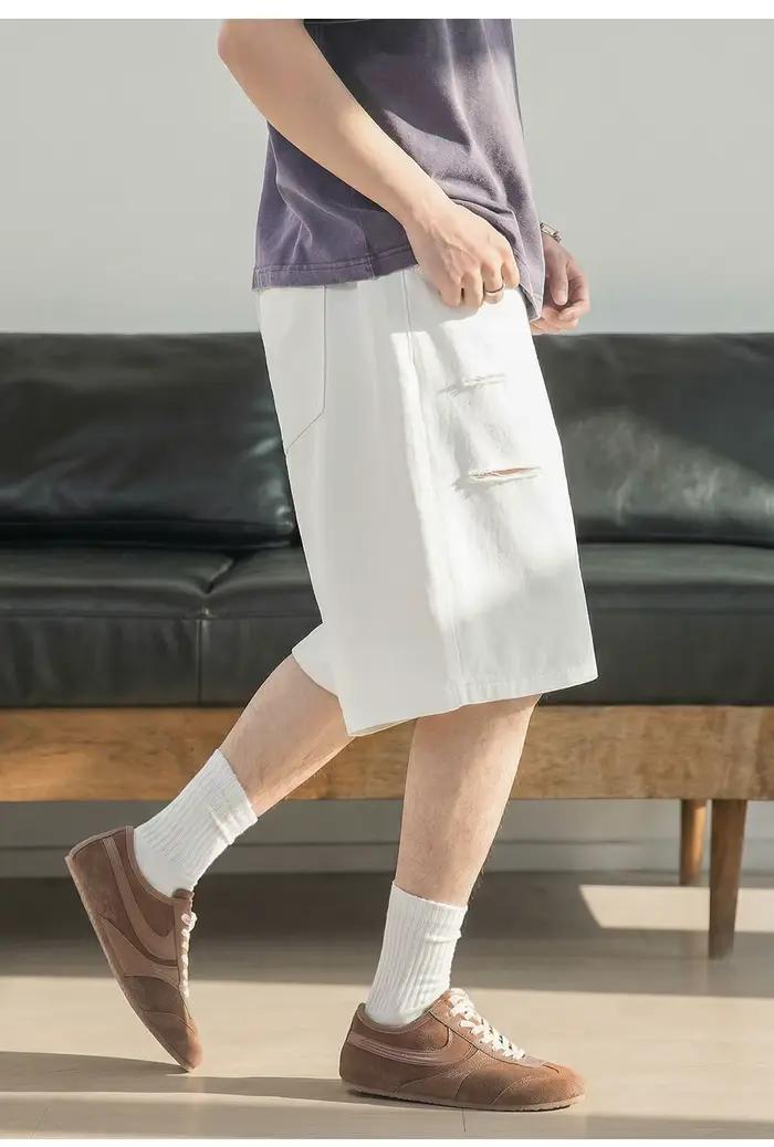 Shorts en jean déchirés à coupe couteau pour homme – Collection été 2026