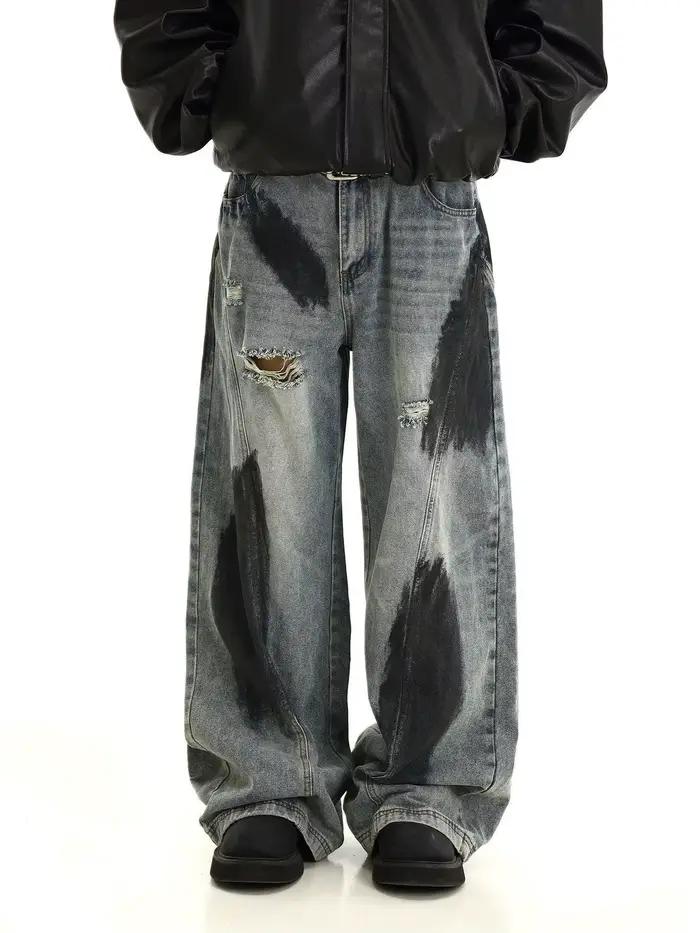Jeans déchirés délavés style graffiti