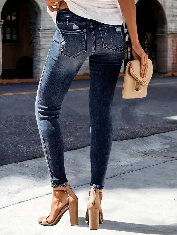Jean slim déchiré en denim délavé à motif barbe de chat